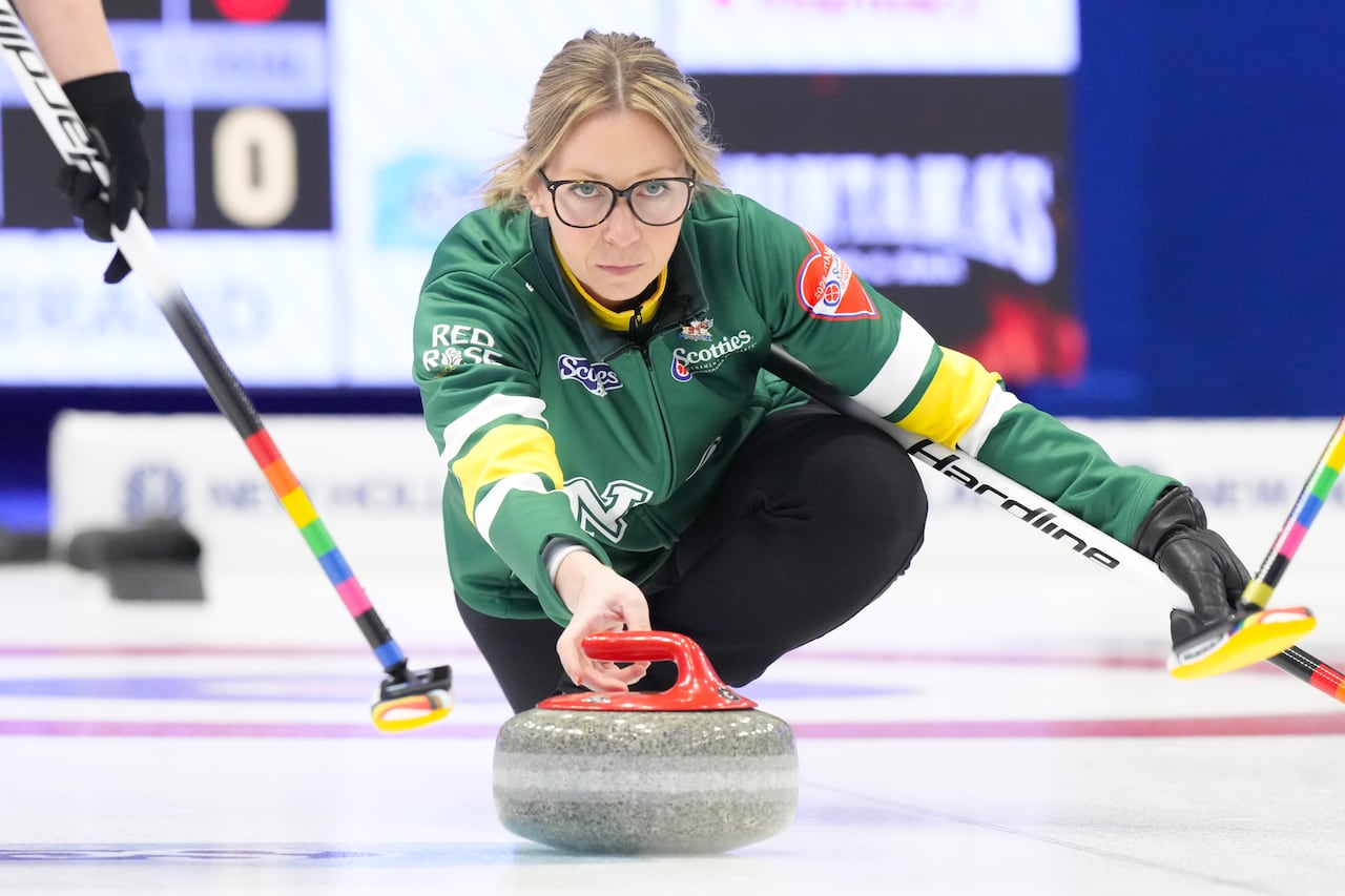 A curling player representing Northern Ontario in action.
